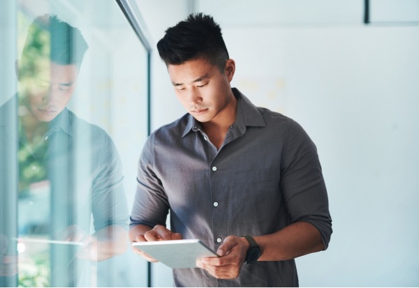 man using tablet in an office